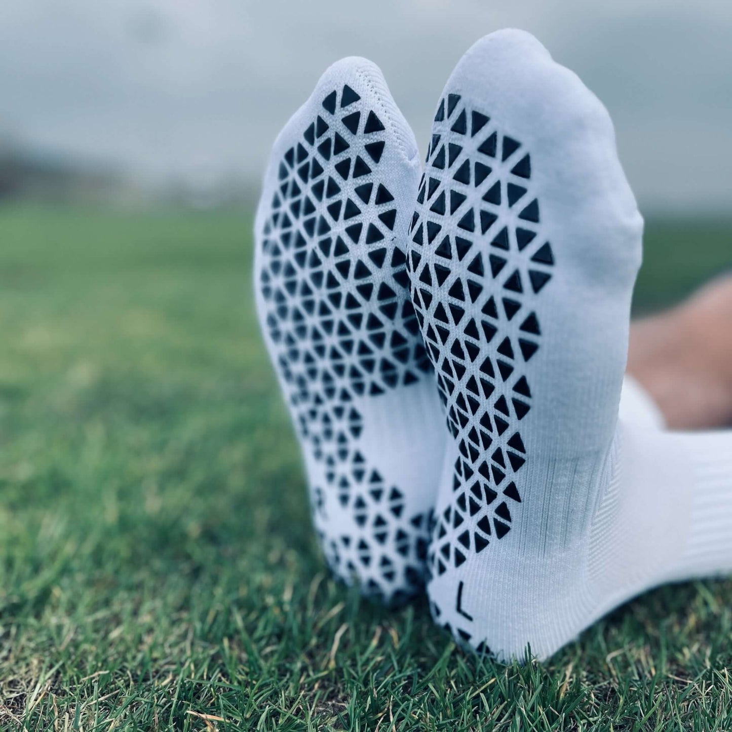 Socken auf Gras Fussohle
